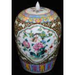 A Chinese porcelain ovoid vase and cover, decorated in a famille rose palette with panels of