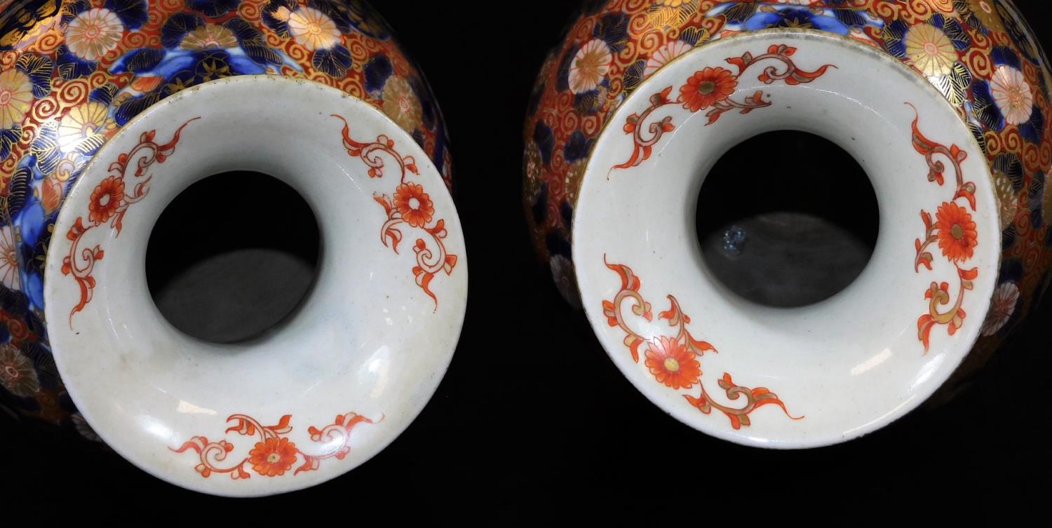 A pair of Meiji period Japanese Imari vases, each of baluster form, profusely decorated with panels, - Image 5 of 6