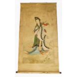 A Chinese scroll, painted with the figure of the goddess of compassion Guan Yin standing on a