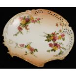 A Royal Worcester blush ivory plate, decorated with flowers and grapes, shape no. 1426, green mark