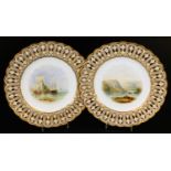 A pair of Minton ribbon plates, decorated with fine landscapes, pattern no. A3082, c1860, 23m Dia.
