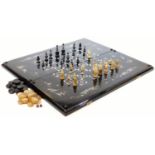 An Oriental design black lacquer and mother of pearl finish games box, of rectangular form, with