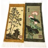 Two 20thC oriental material wall hangings, decorated with flowers, scenes and bamboo, signed with