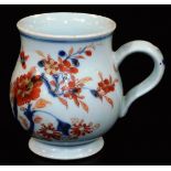 A 18thC Chinese Imari baluster mug with ear handle, predominantly decorated in orange and blue