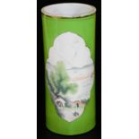 A semi porcelain brush pot of cylindrical form, decorated with panels of figures before trees and