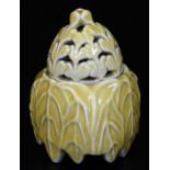 A Japanese porcelain yellow glazed koro and pierced cover, formed as paulpwnia leaves, impressed
