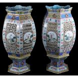 A fine pair of Chinese reticulated porcelain table lanterns, each of octagonal globular form, the