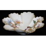 A Royal Worcester blush ivory shallow dish, decorated with stylized flower groups, shape code