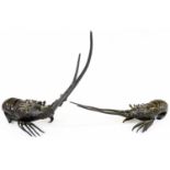 A pair of Japanese bronze figures of crayfish, each in differing poses, with textured undersides,