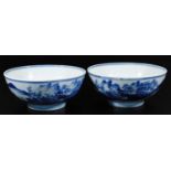 A pair of 19thC Chinese blue and white porcelain bowls, each of circular form, profusely decorated