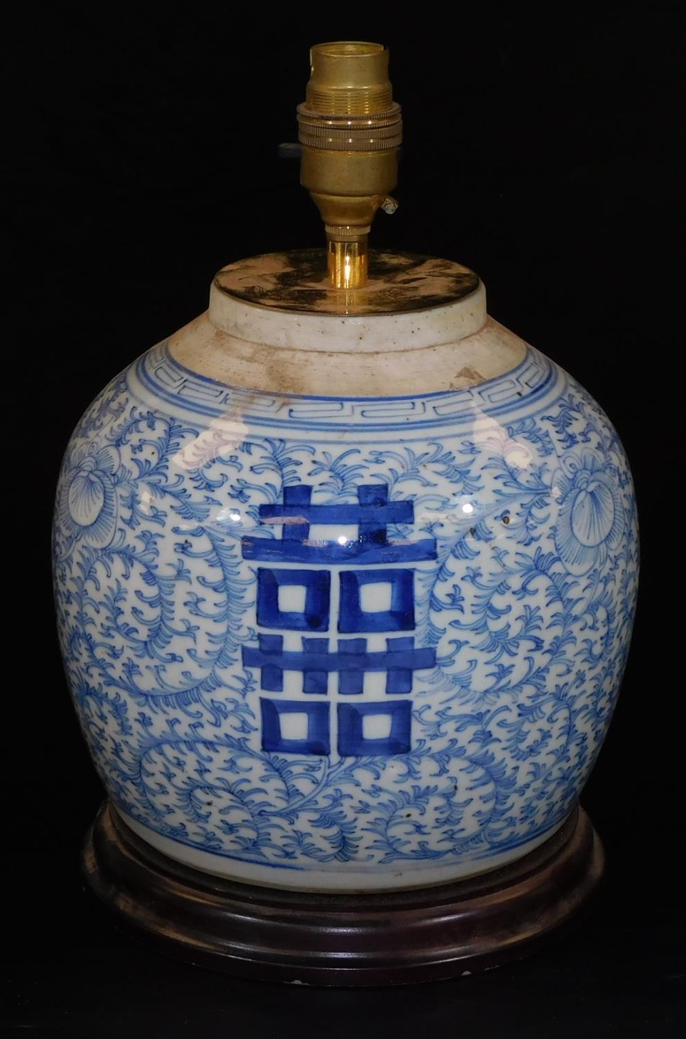 A Chinese blue and white porcelain ginger jar converted to a lamp, with scrolling lotus foliage