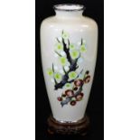 A Japanese cloisonne enamel vase by Tamura, decorated with flowering hawthorn blossoms on a creamy