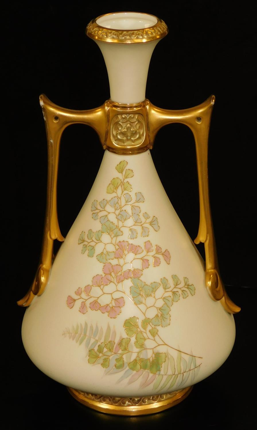 A Royal Worcester blush ivory two handled vase, decorated with tooled ferns, shape code 1021, puce