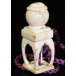 An early 19thC Japanese ivory netsuke, carved as a koro on stand, 5.1cm H. There is no apparent