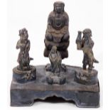 A 19thC figure group stand, formed as three various cast bronze figures, attached to a shaped