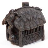 A Taisho period Japanese iron koro and cover, shaped as a thatched hut, with vine growing up one