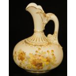 A Royal Worcester blush ivory squat ewer, decorated in gilt and yellow flowers, shape code 1136,