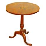 A 19thC mahogany occasional table, with plain circular top on gun barrel supports terminating in tri