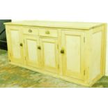 A large pine side cabinet, of rectangular form, set with two frieze drawers above double cupboards f