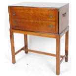 A National Military (Mt Airy) mahogany and ebonised campaign side cabinet, of rectangular form with