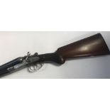 A 12 bore side by side shotgun, marked James & Co Birmingham, serial number 129353. Auctioneer's not