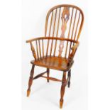 A early 20thC ash and elm high back Windsor chair, with pierced splat on double ring turned legs joi