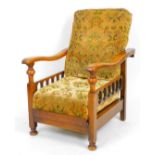 An oak folding chair, with cushions, 63cm W. The upholstery in this lot does not comply with the 19