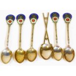 A set of five Elizabeth II silver and enamel golfing teaspoons, set with floral heads for Sutton Col