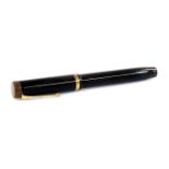 A Parker Duofold Lucky Curve fountain pen, in black with gilt banding and clip, with named nib, mark