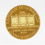 A 1993 Austrian gold Philharmonic coin, marked 1 unze gold, 999.9, 2000 Schilling.