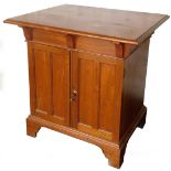 An early 20thC walnut cabinet, with two front panelled doors, revealing a plain interior, on ogee br