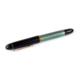 A Pelikan 140 fountain pen, in black and green textured colours with gilt banding and clip, marked n