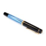 A Pelikan 100 fountain pen, in black and blue textured colours, with gilt coloured banding and clip,