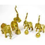 Various brass ware, an elephant with trunk raised, 46cm H, further elephants, pair with feet on orbs