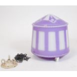 A 20thC glass light shade, in purple and milk glass, with domed top, cylindrical body and shaped scr