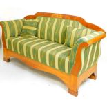 A 19thC Biedermeier settee, upholstered in floral striped material,