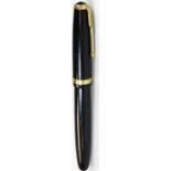 A Parker Duofold fountain pen, in black with gilt coloured arrow and banding with raised section to