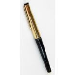 A Geha rolled gold fountain pen, circa 1960, in gilt and black colours with plain clip and circular