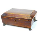 A Regency rosewood casket, with wide crossbanding to the lid, part fitted interior, on hairy paw fee