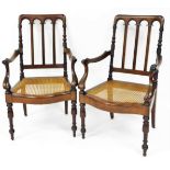 A pair of 19thC Colonial style mahogany carver chairs, each with pierced mitre vertical back splats