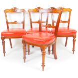 A set of four late Victorian mahogany dining chairs, each with carved shell cresting rails, horizont