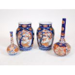 Various Japanese Meiji period Imari, comprising a pair of vases, each set with panels of flowers on