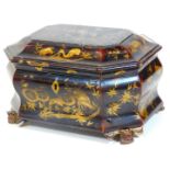 A 19thC Japanned papier mache tea caddy, of octagonal form set with exotic birds and flowers, with i