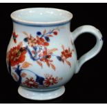 A 18thC Chinese Imari baluster mug with ear handle, predominantly decorated in orange and blue with