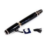 A Montblanc Boheme fountain pen, black with chrome coloured clip and banding, with star to the lid,