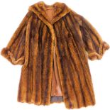 A ladies three quarter length fur coat, unmarked, without label, 107cm H.