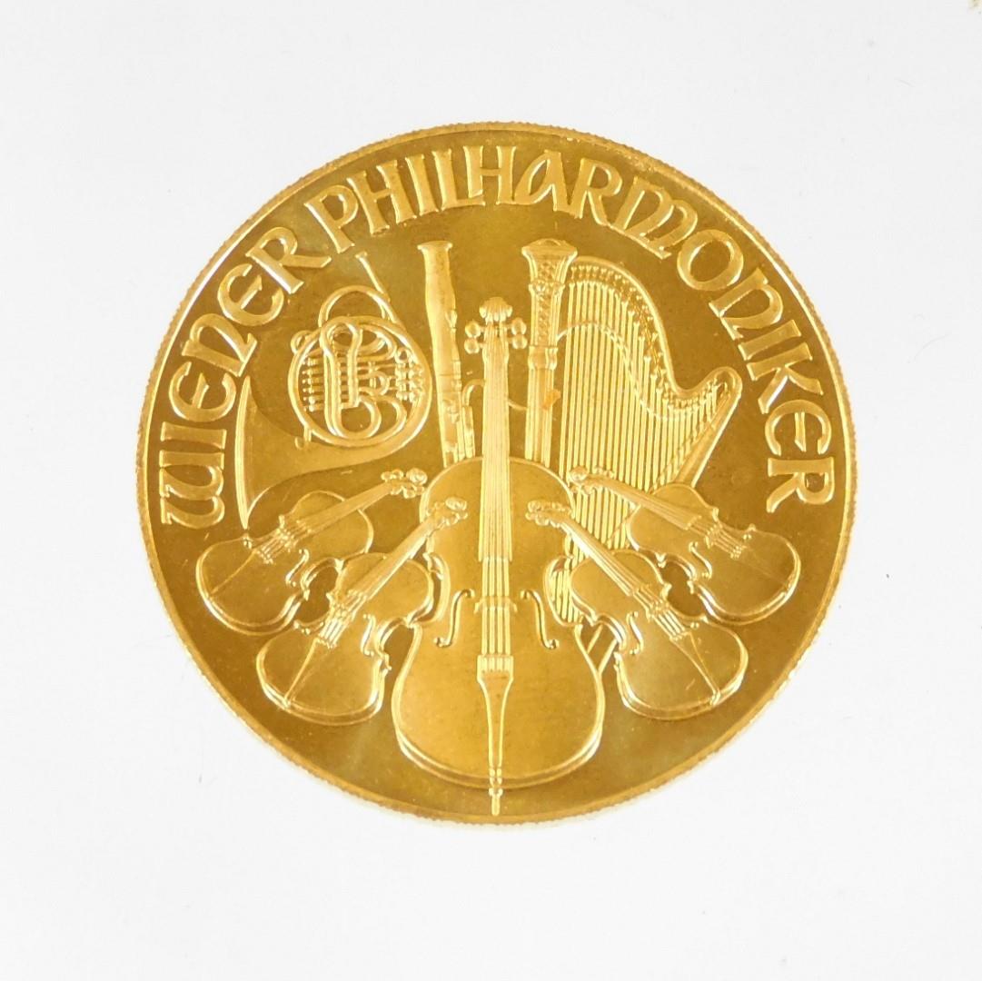 A 1995 Austrian gold Philharmonic coin, marked 1 unze gold, 999.9, 2000 Schilling. - Image 2 of 2