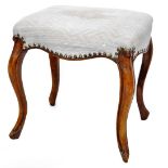 A 19thC stool, the serpentine top overstuffed in a (later) textured blue material, on cabriole legs,
