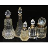 Various dressing table bottles, to include one of cone shape form with silver collar and flame stopp