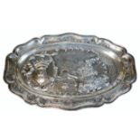 An 18thC French pre-revolution pewter platter, of shaped oval design with scroll, scale and floral b